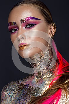Beautiful girl with creative glitter makeup, sparkles, unusual eyebrows. Beauty is an art face.