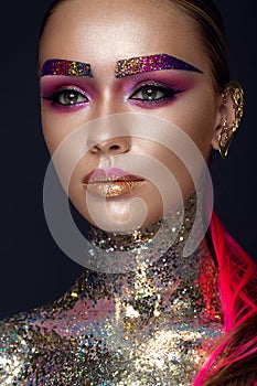 Beautiful girl with creative glitter makeup, sparkles, unusual eyebrows. Beauty is an art face.