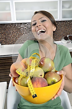 Beautiful girl with dish of fruits