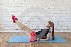 Beautiful girl doing fitness loft interior