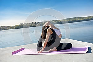 Beautiful  girl doing a yoga pose early morning before working time. Healhty lifestyle