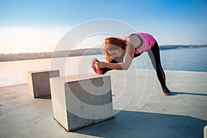 Beautiful  girl doing a yoga pose early morning before working time. Healhty lifestyle