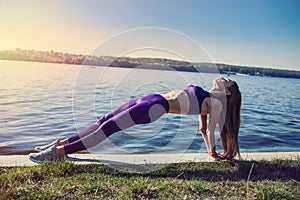 Beautiful  girl doing a yoga pose early morning before working time. Healhty lifestyle