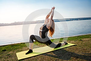 Beautiful  girl doing a yoga pose early morning before working time. Healhty lifestyle