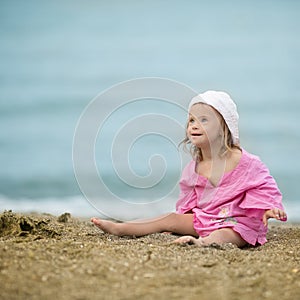 Beautiful girl with Down syndrome on the beach