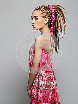Beautiful girl with dreadlocks. pretty young woman with African braids