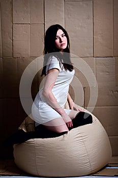 Beautiful girl in a dress in the Studio