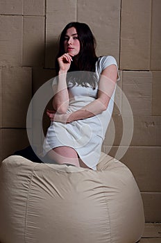 Beautiful girl in a dress in the Studio