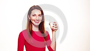 Beautiful Girl Drinking a Glass of Pure Water Smiling