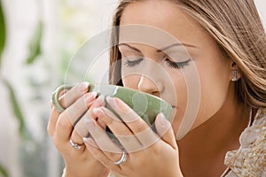 Beautiful girl drinking tea