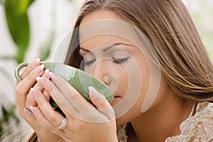 Beautiful girl drinking tea