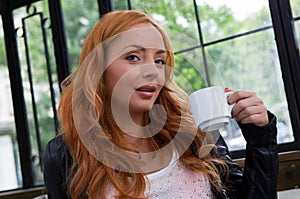 Beautiful Girl Drinking Tea or Coffee