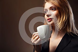 Beautiful Girl Drinking Tea or Coffee