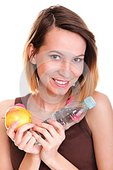 Beautiful girl drinking water from blue bottle isolated