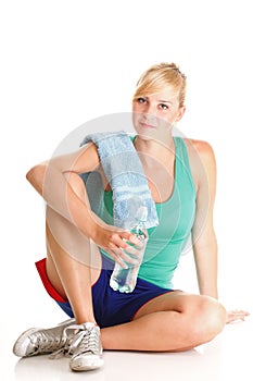 Beautiful girl drinking water blue bottle isolated