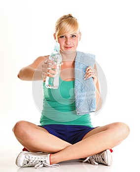 Beautiful girl drinking water blue bottle isolated