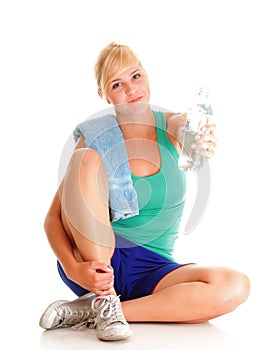 Beautiful girl drinking water blue bottle isolated