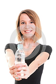 Beautiful girl drinking water from blue bottle isolated