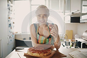 Beautiful girl eating tasty pizza