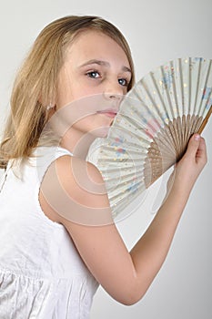 Beautiful girl with a fan