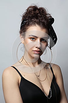 Beautiful girl with fancy circle earrings and temporary tattoo