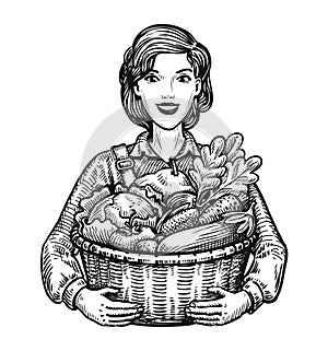 Beautiful girl or happy farmer holding a wicker basket full of vegetables. Agriculture, horticulture, farm concept. Hand photo