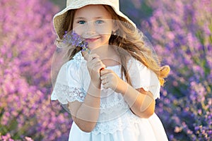 Beautiful girl in a field with lavender.