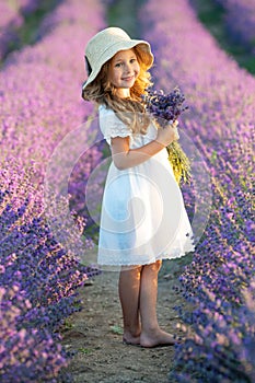 Beautiful girl in a field with lavender.