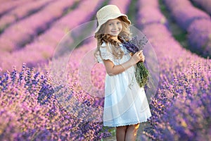 Beautiful girl in a field with lavender.