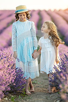 Beautiful girl in a field with lavender.