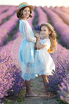 Beautiful girl in a field with lavender.