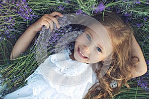 Beautiful girl in a field with lavender.