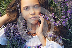 Beautiful girl in a field with lavender.