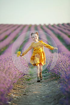 Beautiful girl in a field with lavender.