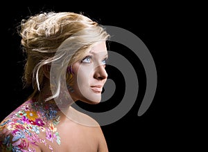 Beautiful girl with floral theme bodyart