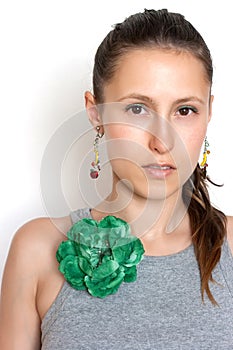 Beautiful girl with a flower brooch