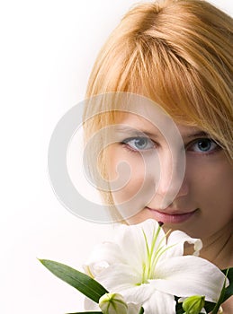 Beautiful girl with the flower of lily