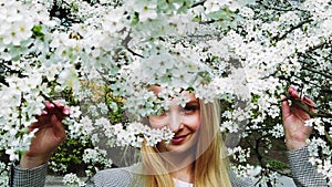 Beautiful girl on the flower trees background