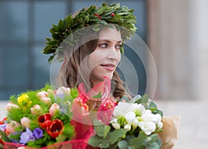 Beautiful girl with flowers graduated
