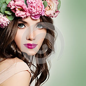 Beautiful Girl with Flowers Wreath. Long Permed Curly Hair