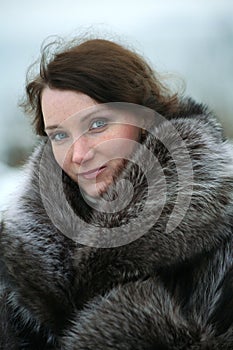 Beautiful girl in a fur coat