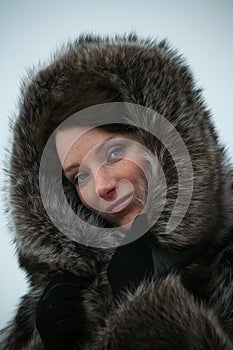 Beautiful girl in a fur coat