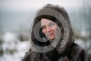 Beautiful girl in a fur coat