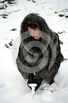 Beautiful girl in a fur coat