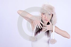 Beautiful Girl in Furry Hat. Winter Woman Portrait