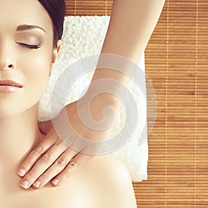 Beautiful girl getting face lifting massage in spa salon. Health care, rejuvenation and relaxation concept.