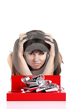 Beautiful girl with gift in red box with silver ribbon on white