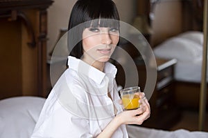 Beautiful girl with glass of orange juice