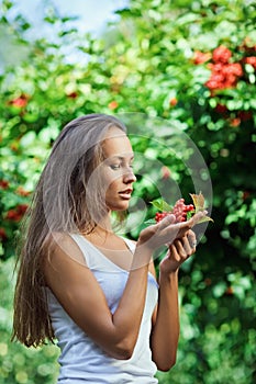 Beautiful girl with guelder rose photo