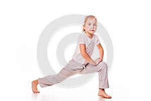 Beautiful girl gymnast exercising, stretching